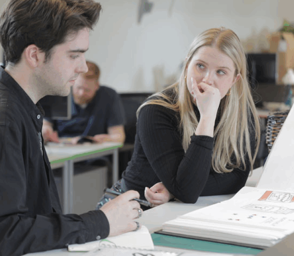 Multiply colleagues discussing designs