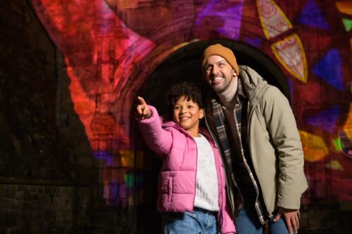 Adult man and child looking at an exhibit