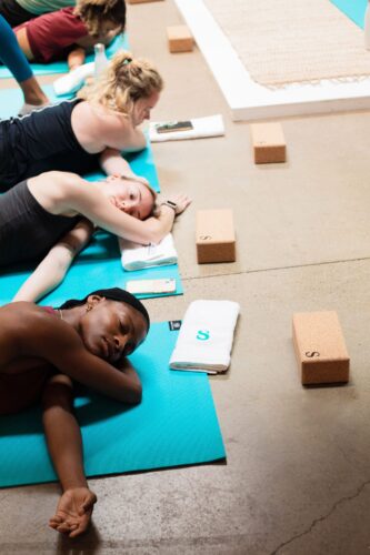 Women relaxing in a yoga pose